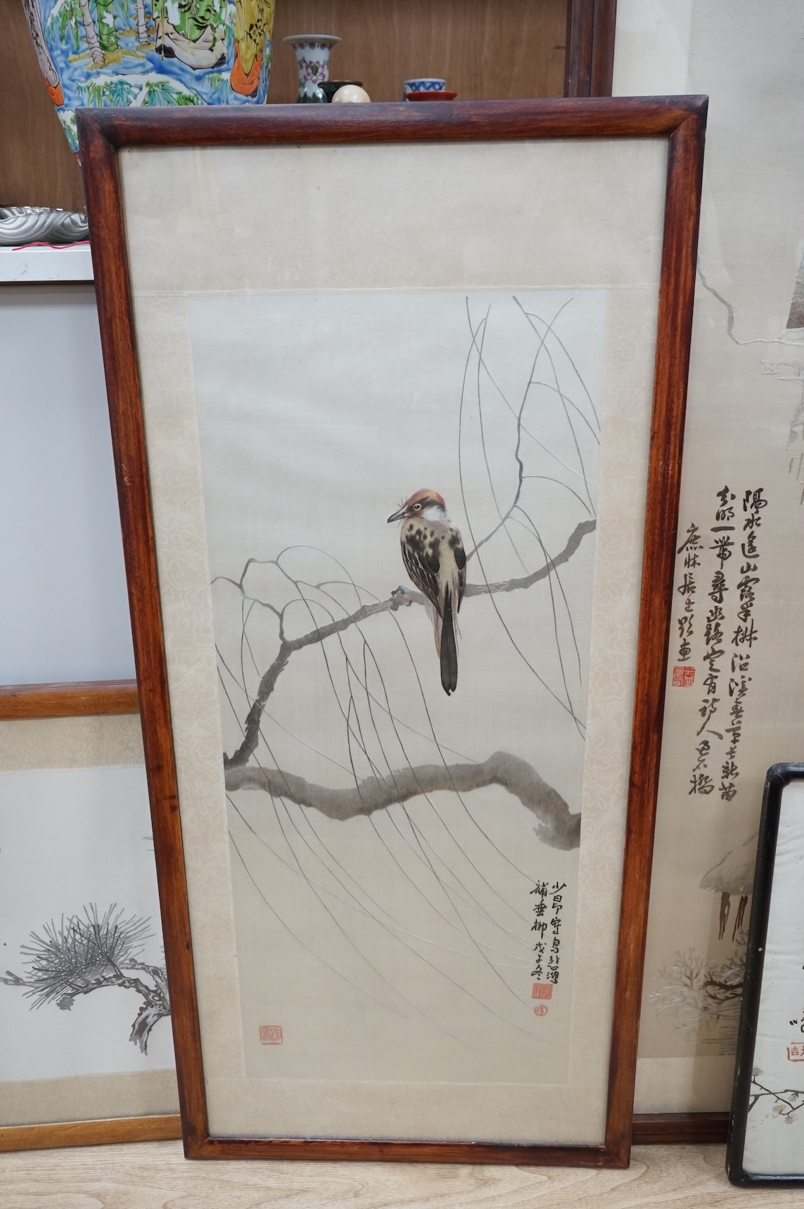 Seven Chinese embroideries on silk, mountainous landscapes and birds, largest 121cm high